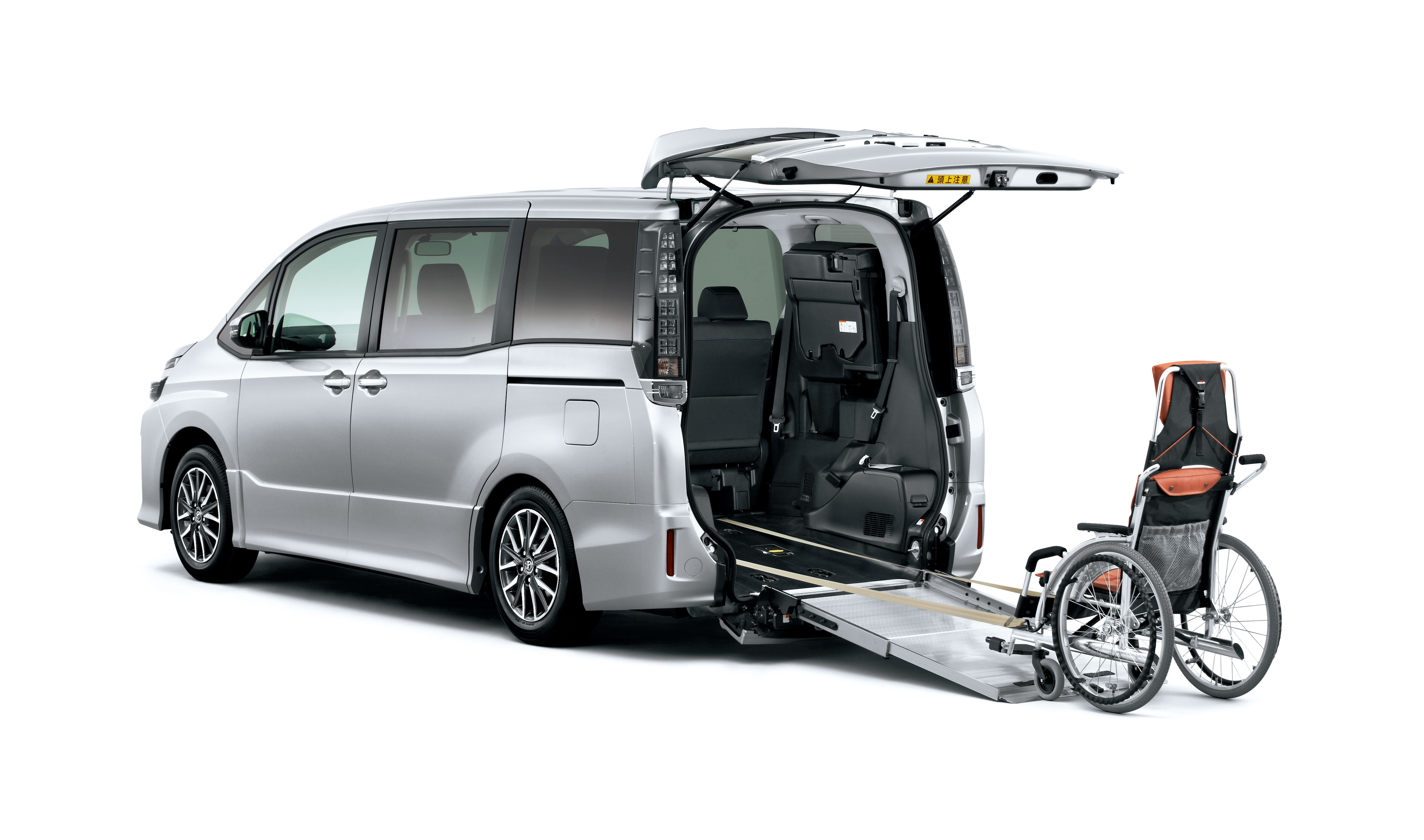 Wheelchair-accessible vehicle with a side ramp